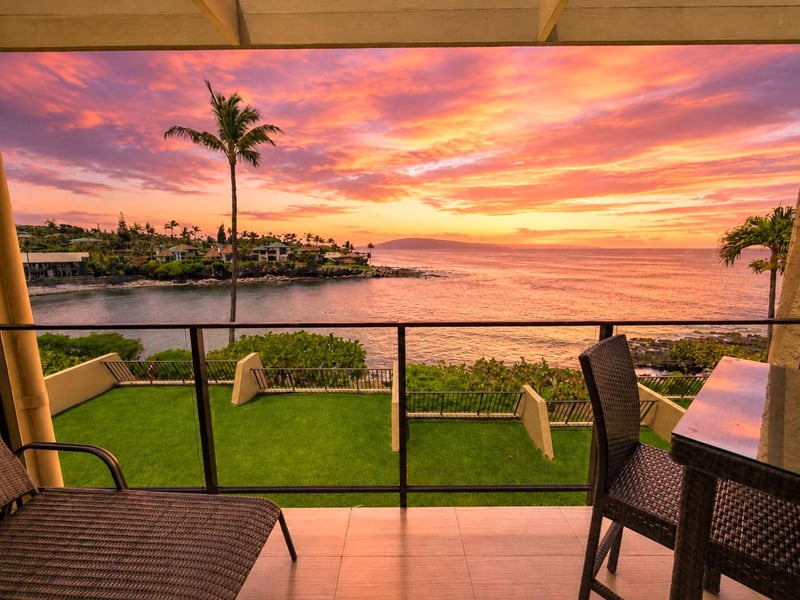 Your private lanai frames a warm Maui sunset over the water
