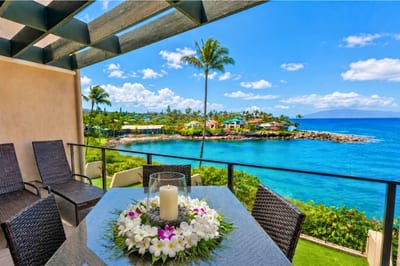 The lanai features unobstructed views of Napili Bay