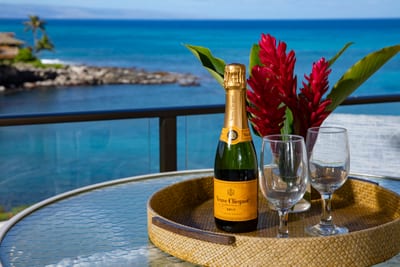 Toast to paradise from your private lanai, where sparkling ocean views and tropical blooms create a picture-perfect dining escape