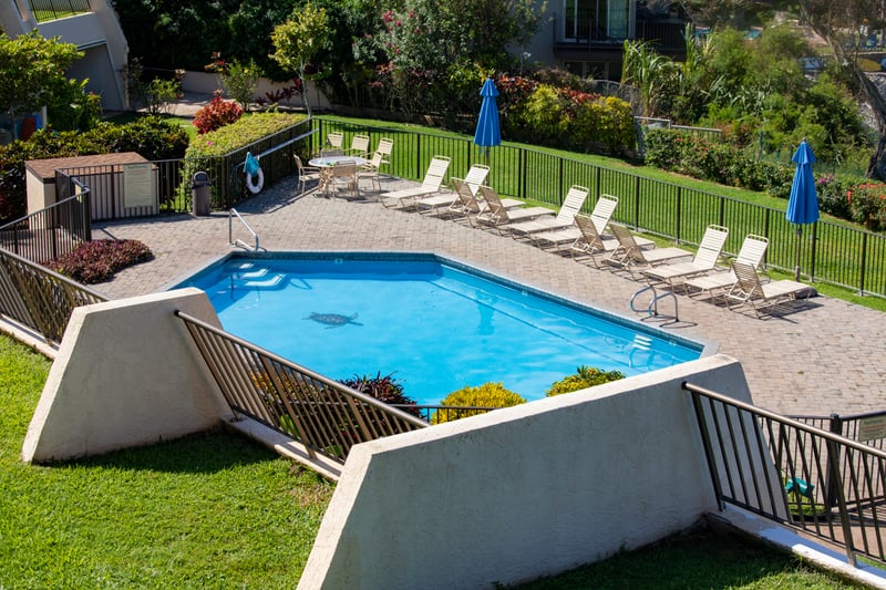 Bask poolside with panoramic ocean views, where tropical comfort meets timeless coastal elegance