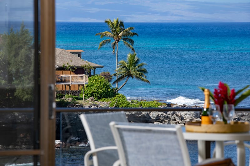 Indulge in oceanside dining with a backdrop of turquoise waves, lava rock cliffs, and swaying coconut palms in the breeze