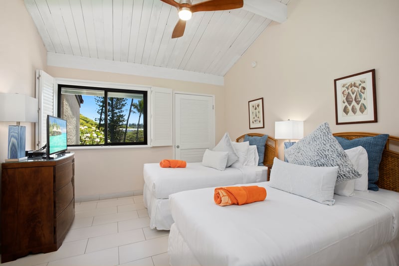 Airy and bright with twin beds, high ceilings, tropical charm, and peaceful views from large shuttered windows