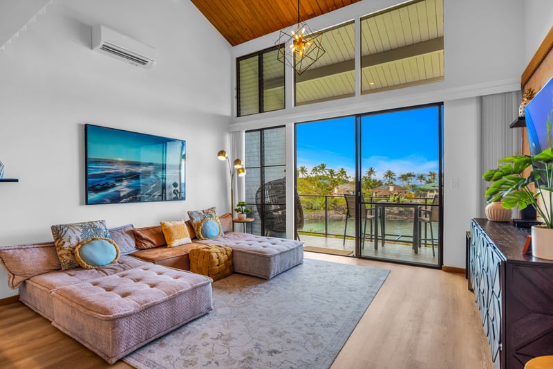 A bright, open living room connects seamlessly to the kitchen and dining, keeping everyone together from breakfast to sunset.