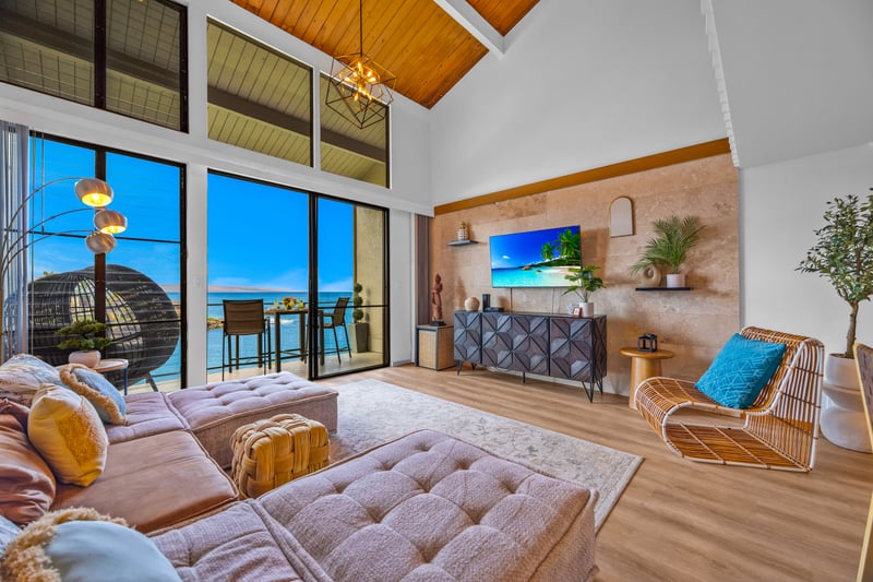 Open concept living makes it easy to move from sofa to dining to lanai, with bright natural light throughout.