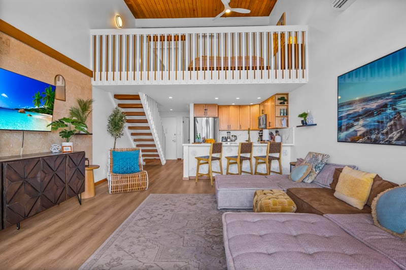Stretch out on the sectional while the ocean view steals the show, with the lanai just steps away for fresh air.