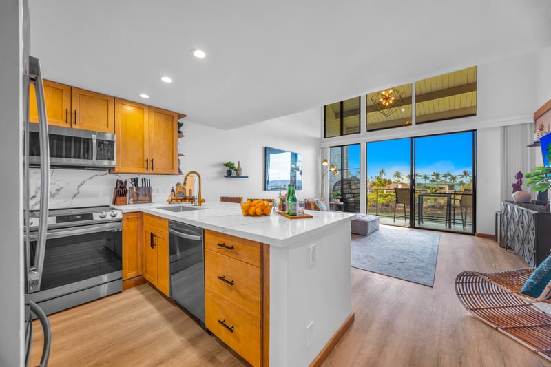 From the kitchen, you can keep an eye on the living area and lanai, making meals feel social and effortless.
