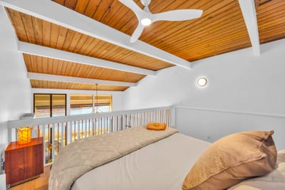 This guest bedroom view highlights the clean lines and cozy bedding, a restful place to recharge between adventures.