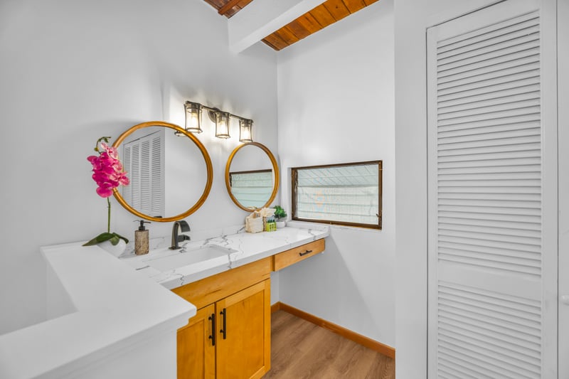 Guest bath features a bright vanity area and crisp finishes, making it easy to share the space during busy mornings.