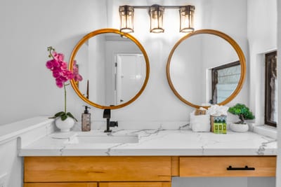 This guest bath angle highlights the vanity and mirrors, keeping routines simple whether you are heading out or winding down.