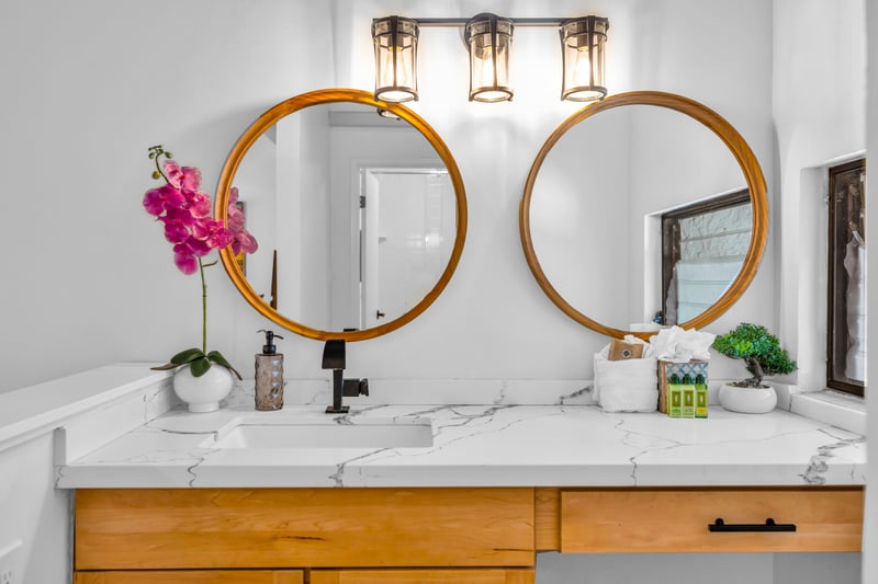 This guest bath angle highlights the vanity and mirrors, keeping routines simple whether you are heading out or winding down.