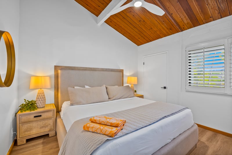 Settle into the primary bedroom with vaulted ceilings and a calm, uncluttered layout designed for restful nights.