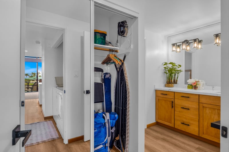 A wider bath view shows practical storage and a polished vanity, giving you space for toiletries and daily routines.