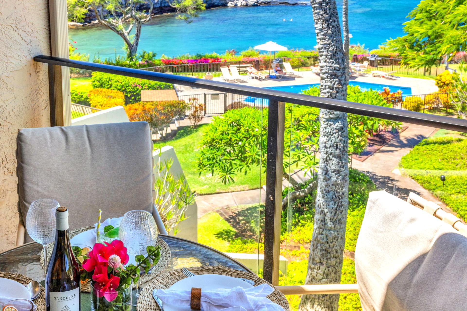 Savor island breezes with pool and ocean views from your private lanai, perfect for sunset dining and relaxation. NAP-C37