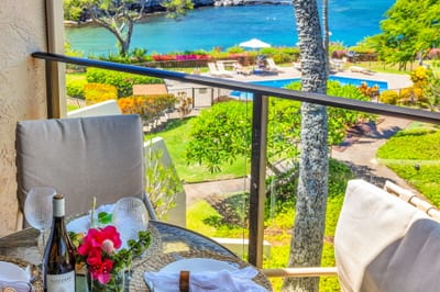 Savor island breezes with pool and ocean views from your private lanai, perfect for sunset dining and relaxation. NAP-C37