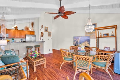 Charming great room with a full kitchen, bar seating, and inviting décor—perfect for sharing meals and memories. NAP-C37