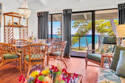 Bright and airy living space with tropical décor and stunning ocean views—perfect for relaxing after a day of island adventures. NAP-C37