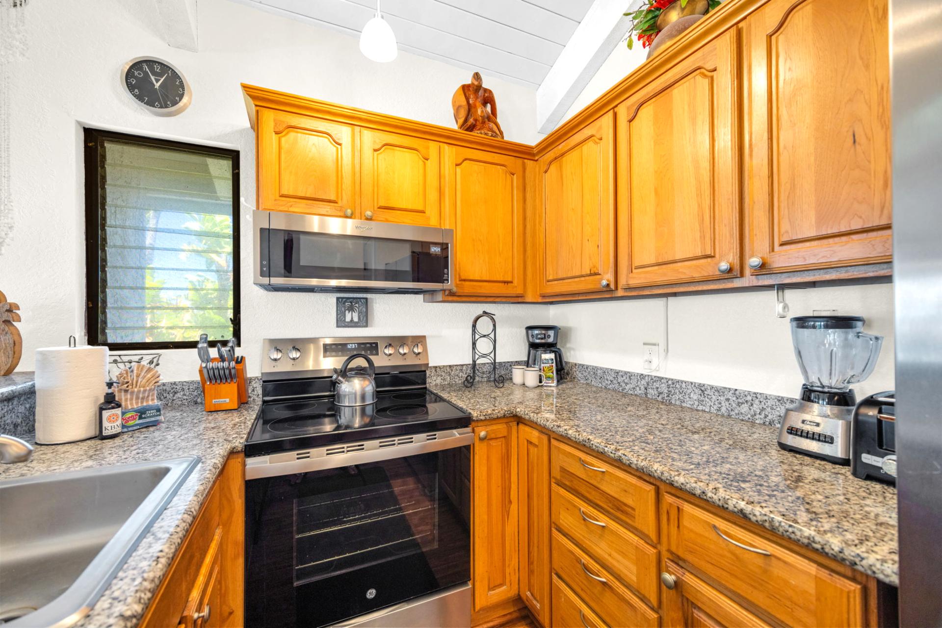 Well-appointed kitchen with modern appliances, granite countertops, and everything you need for a home-away-from-home experience. NAP-C37