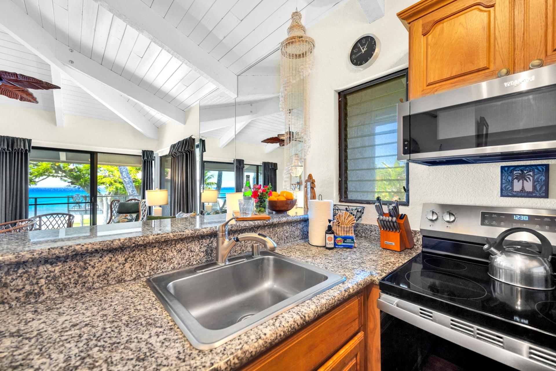 Ocean-view kitchen with granite countertops—start your day with coffee and a stunning island backdrop. NAP-C37