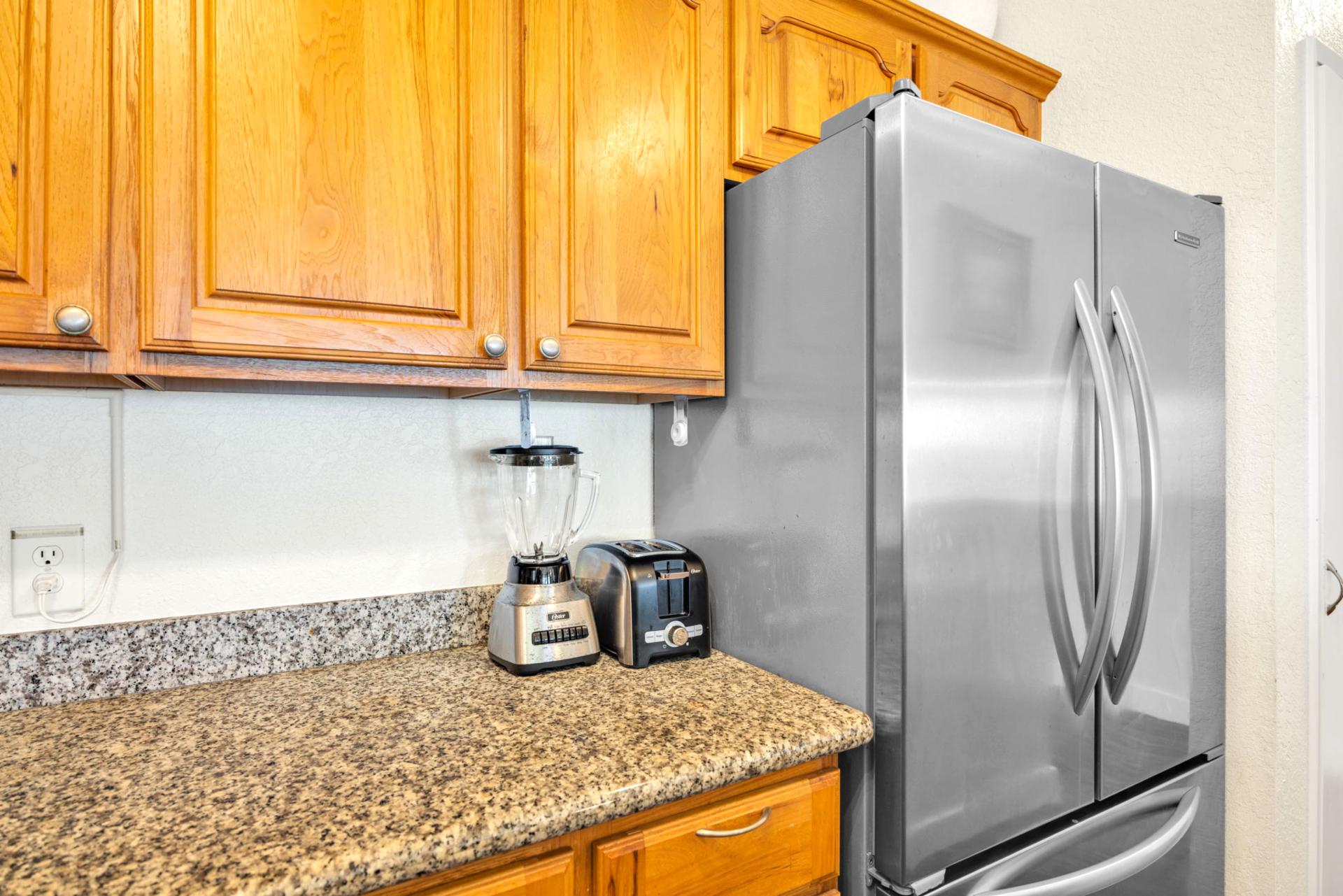 Modern stainless-steel refrigerator and countertop appliances for all your vacation cooking needs NAP-C37