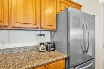Modern stainless-steel refrigerator and countertop appliances for all your vacation cooking needs NAP-C37