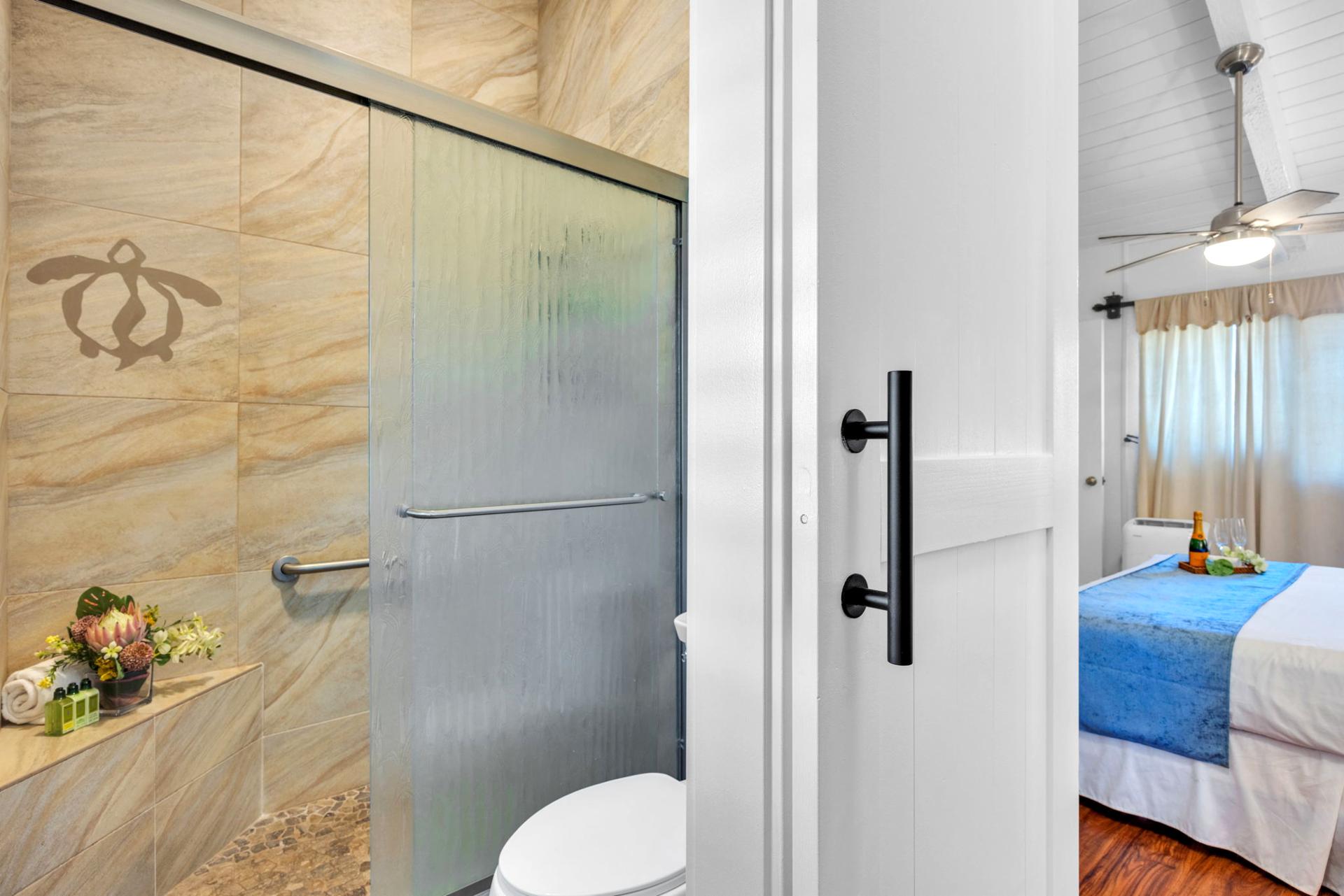 Spa-inspired walk-in shower with elegant tilework and island accents for a refreshing retreat. NAP-C37