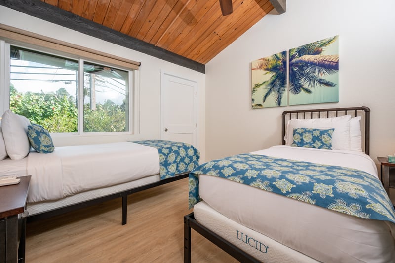 Bright and breezy guest room with natural textures, island accents, and tranquil garden-facing windows NAP-C43