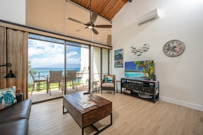 With vaulted ceilings and wall-to-wall ocean views, this breezy haven blends island calm with modern cool charm