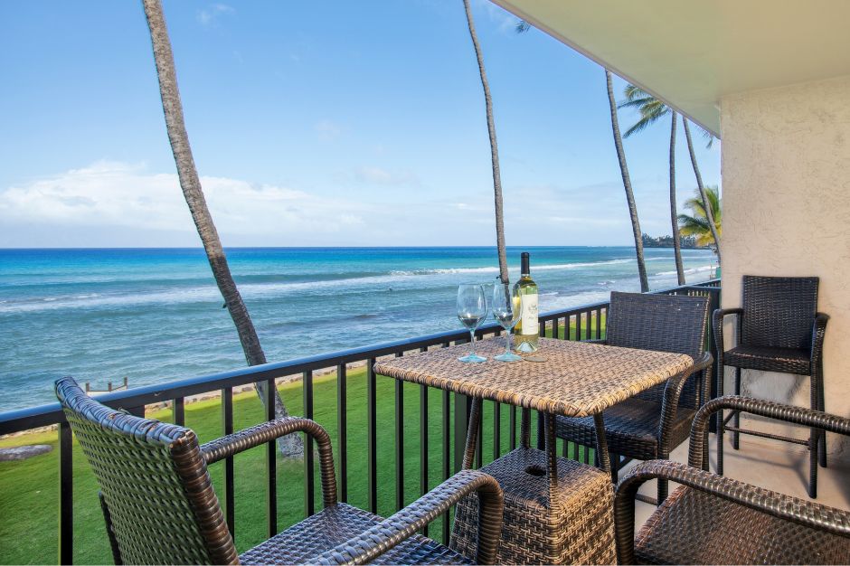 Watch the waves from this top-floor lanai with outdoor dining and panoramic coastline views.