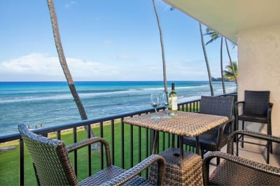 Watch the waves from this top-floor lanai with outdoor dining and panoramic coastline views.