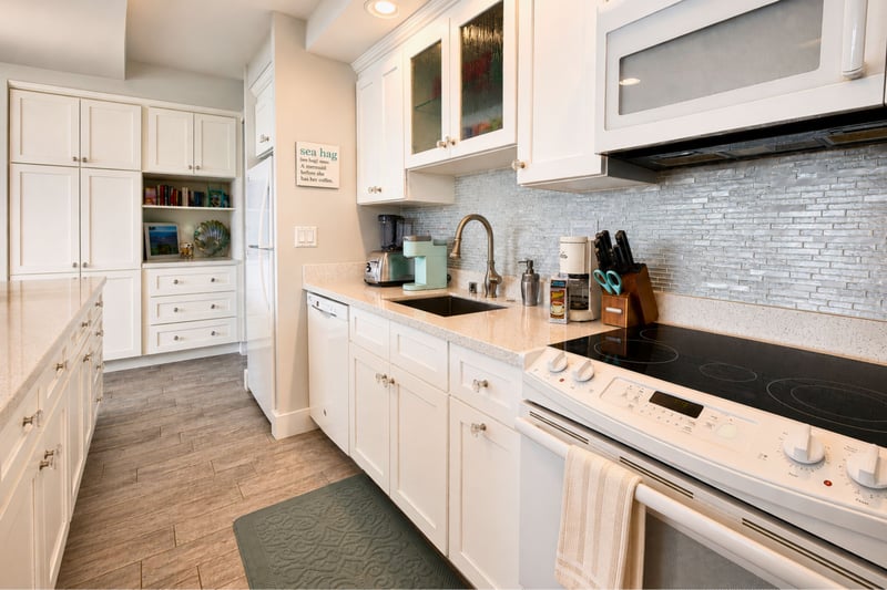 Fully equipped kitchen with quartz counters, stainless appliances, and everything you need to cook at home.