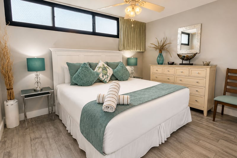 Primary bedroom with a King bed, ceiling fan, and coastal accents for a peaceful night’s sleep.