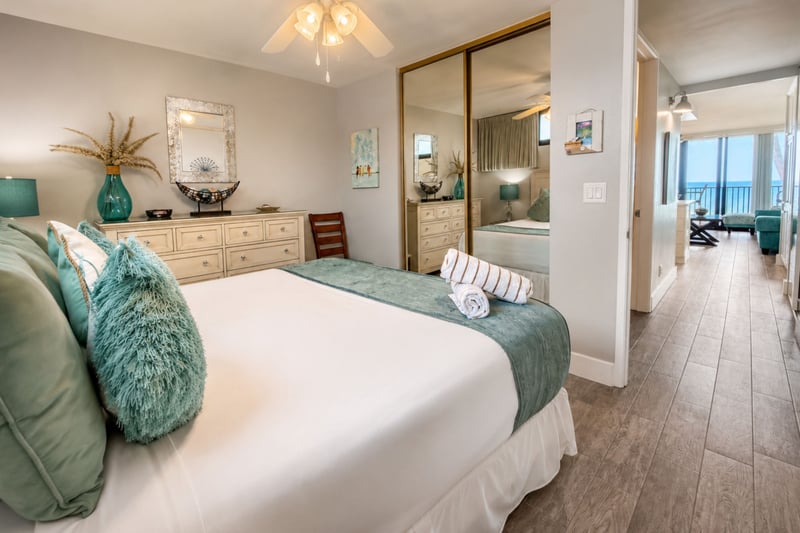 King bed and coastal-inspired furnishings create a serene space to rest after beach days.