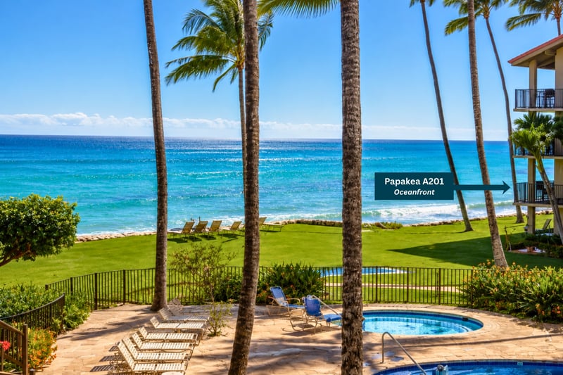 Enjoy the Papakea A-201 oceanfront location with sweeping lawn, palm trees, and pool just steps from your lanai.