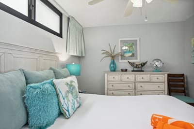 King bed and coastal-inspired furnishings create a serene space to rest after beach days.