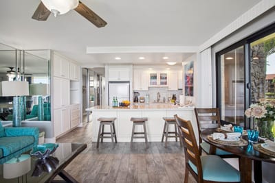 Bar seating connects the fully equipped kitchen to the living area, keeping meals and conversation flowing.