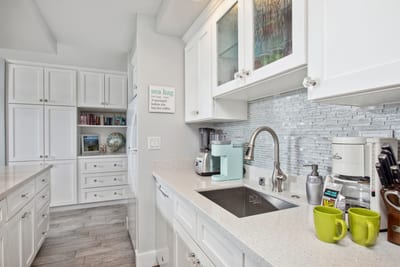 Fully equipped kitchen with quartz counters, stainless appliances, and everything you need to cook at home.