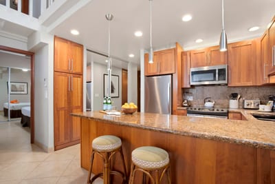 From the stainless fridge to the wood-paneled island, every detail in this kitchen is built for comfort and style