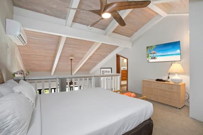 Vaulted ceilings and cozy corners make this loft suite a restful haven for family or friends to unwind