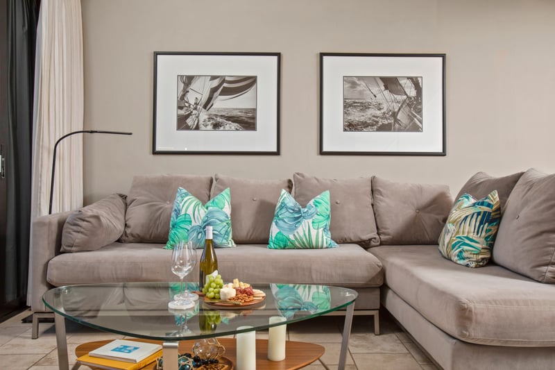 Sip and snack in style on this plush sectional, framed by striking monochrome art and glowing natural light    