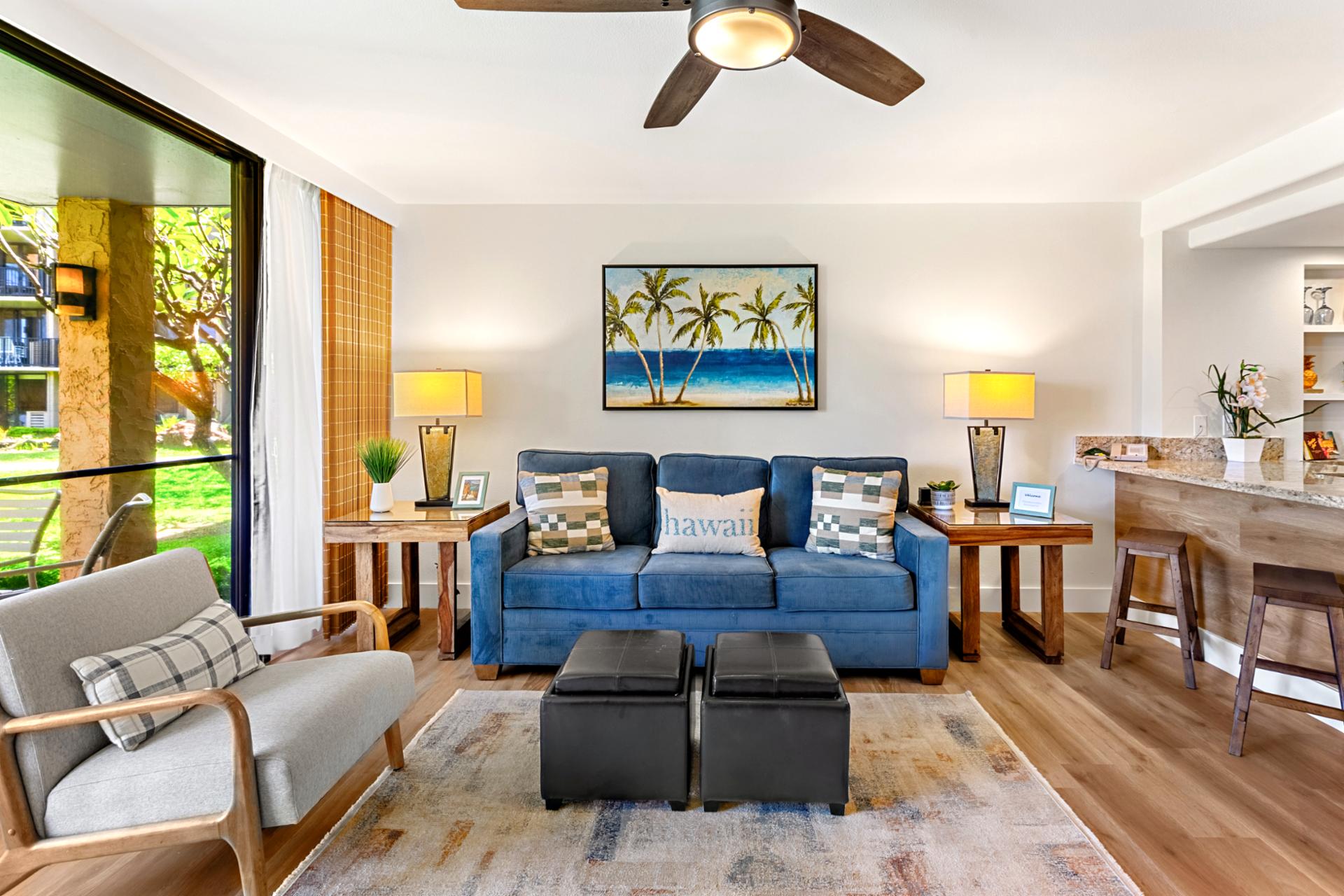 Comfortable sofas and warm wood floors create an inviting space where you can unwind after a day exploring Kaanapali’s beaches.