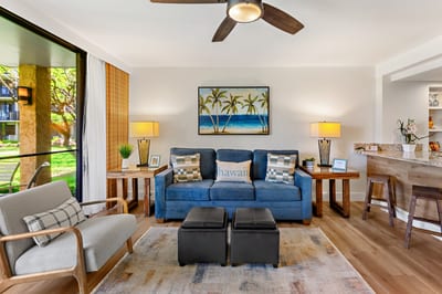 Comfortable sofas and warm wood floors create an inviting space where you can unwind after a day exploring Kaanapali’s beaches. PKD-104