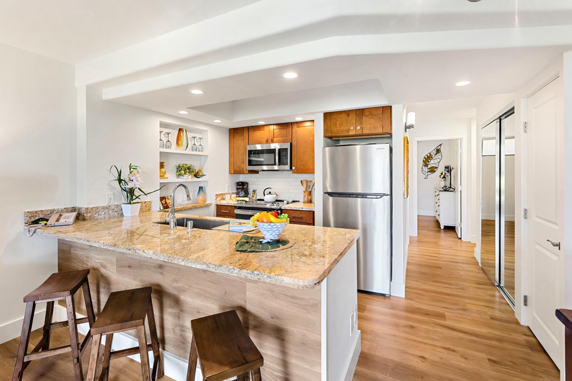 Prepare island inspired dishes in your well equipped kitchen with full size refrigerator, oven, microwave, and dishwasher.