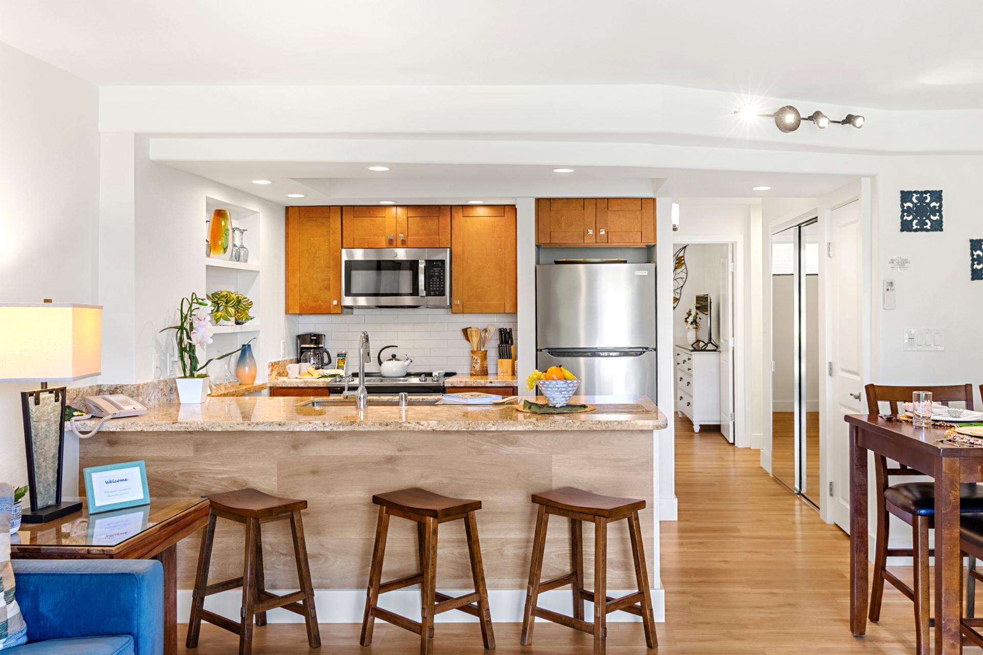 Granite countertops and stainless steel appliances, plus plenty of space to prep meals or gather for pupu and drinks.