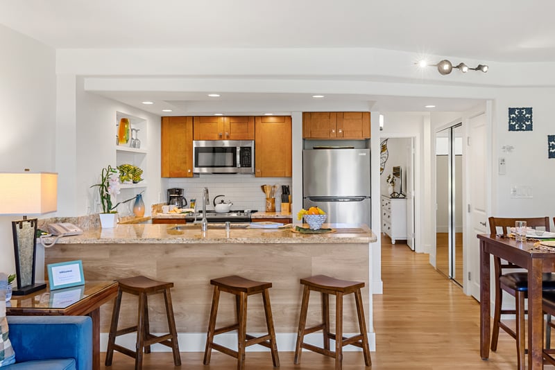 Granite countertops and stainless steel appliances, plus plenty of space to prep meals or gather for pupu and drinks. PKD-104