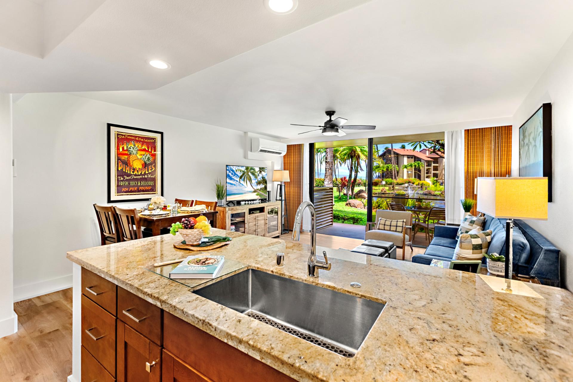 Your kitchen’s breakfast bar offers additional seating, ideal for quick bites before morning walks along the oceanfront path.