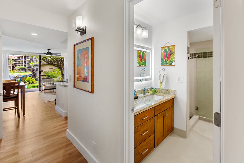 Fresh white finishes and ample counter space make your bathroom bright, practical, and easy to share. PKD-104
