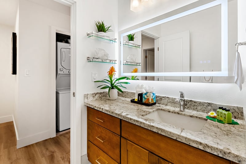 Your bathroom includes a granite countertop and spacious vanity, giving you room to spread out with ease. PKD-104