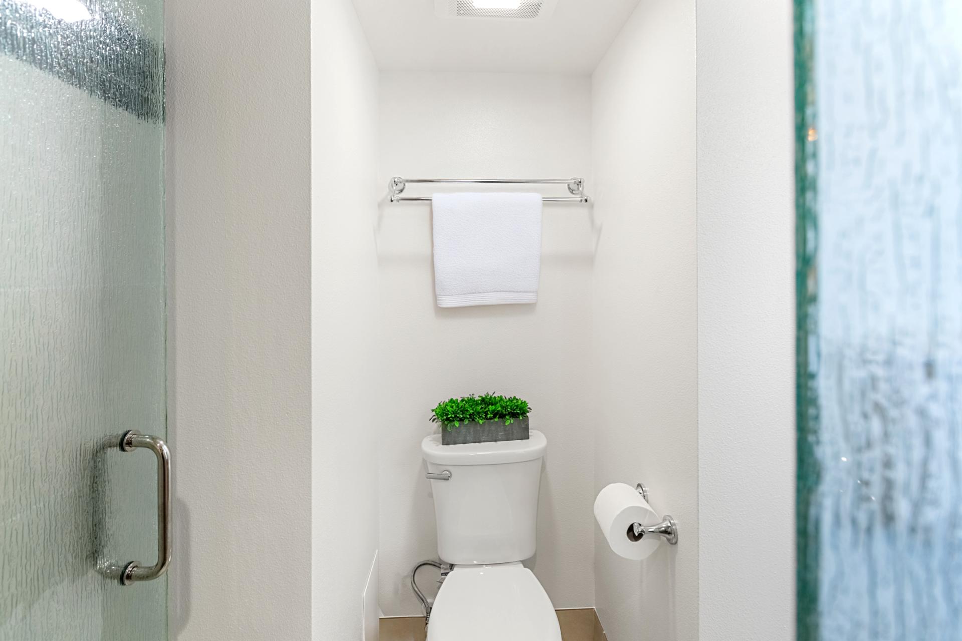 Clean tiled shower and tub surround provide a refreshing space to start or end your Maui adventures.