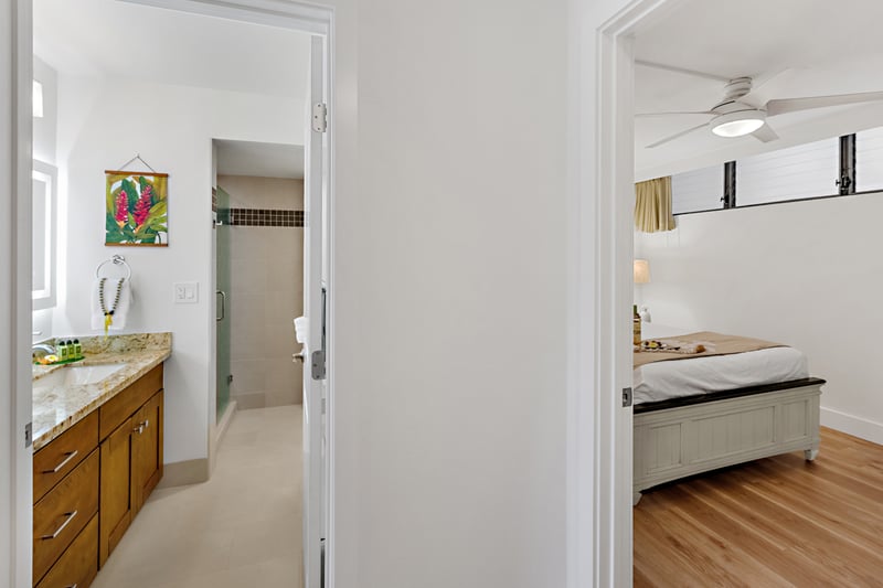 Hallway access leads you from bedroom to bath, creating a functional layout that keeps your space open and connected. PKD-104