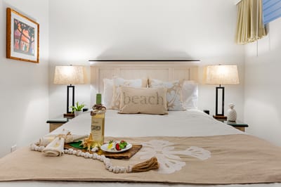 Neutral decor and plush bedding create a peaceful retreat where you can recharge between beach adventures. PKD-104